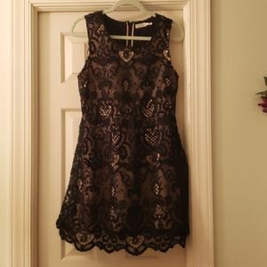 Black lace dress with hidden back zipper.